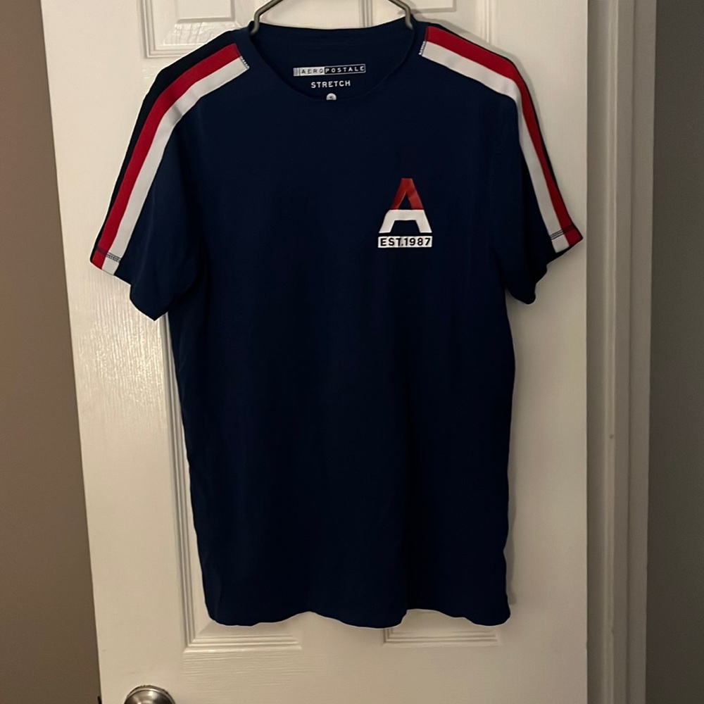 Navy blue shirt with white and red stripes